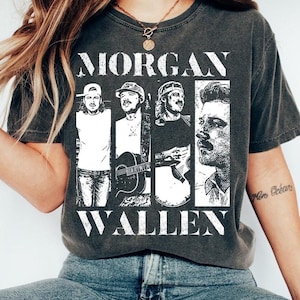 May include: Dark grey t-shirt with the name "MORGAN WALLEN" in large white block letters. The shirt features four black and white images of a man in different poses. The t-shirt is made of a soft material.