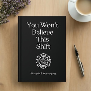 May include: A black notebook with the text "You Won't Believe This Shift" and a fire department emblem. The notebook also has the text "but I wrote it down anyway". A pen and a cup of coffee are next to the notebook.