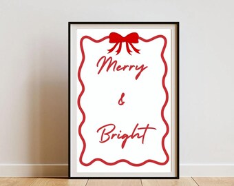 May include: A white printable sign with a red border and a red bow at the top. The sign says "Merry & Bright".