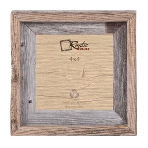 May include: A rustic wood picture frame with a double border. The frame is made from 100% recycled materials and is made in the USA. The frame is 4x4 inches and has a light brown and grey finish.