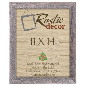 May include: A rustic wood picture frame with a gray wash finish. The frame is 11 inches by 14 inches and is made from 100% recycled material. The frame is made in the USA and is available from Rustic Decor LLC in Oklahoma City, OK.  Rustic Decor LLC is a small business that specializes in handmade rustic home decor.