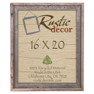 May include: A rustic wood picture frame with a light brown background. The frame is 16 inches by 20 inches and is made from 100% recycled material. The text "Rustic decor" is written in brown and gray lettering. The text "16 X 20" is written in brown lettering. A green recycling symbol is in the center of the image. The text "100% Recycled Material Made in the USA Oklahoma City, OK 73128 rusticdecorllc.com" is written in black lettering.