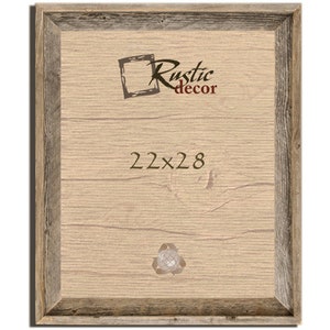 May include: A rustic wood picture frame with a light brown wood finish and a dark brown wood border. The frame is 22 inches by 28 inches. The text "Rustic decor" is printed in the upper right corner of the frame.