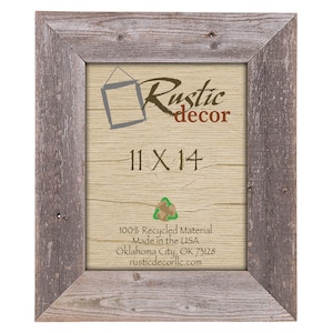 May include: A rustic wood picture frame with a weathered gray finish. The frame is 11 inches by 14 inches and is made from 100% recycled material. The frame is made in the USA and is available from Rustic Decor.