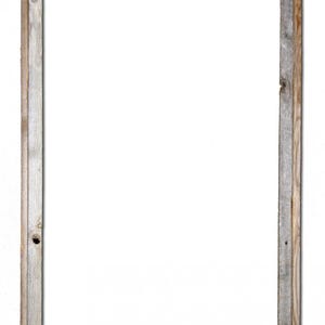 May include: A rustic wooden picture frame with a weathered grey and brown finish. The frame has a simple, rectangular design and is perfect for displaying photos or artwork.