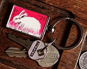 White Angora Rabbit Keyring - made with upcycled postage stamp from Bulgaria 1986