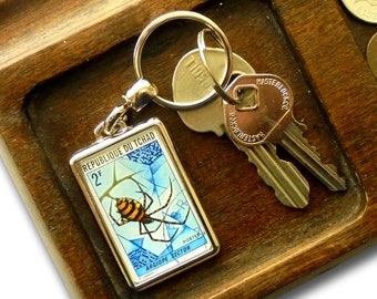 Orb Web Spider Keyring - upcycled vintage 1972 Chad postage stamp