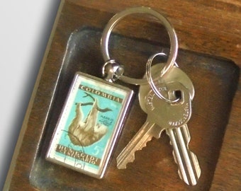 Two Toed Sloth Keyring, upcycled 1960 postage stamp from Colombia
