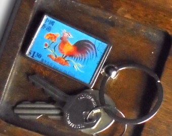 Chinese Year of the Rooster Keyring made with postage stamp from Hong Kong, 1999