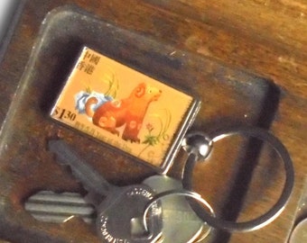 Chinese Year of the Dog Keyring made with postage stamp from Hong Kong, 1999