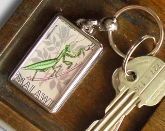 Praying Mantis Keychain - upcycled vintage 1970 Malawi postage stamp