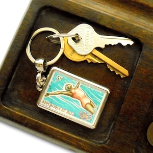Retro Swimmer Keyring - Mali keychain upcycled with vintage 1965 postage stamp