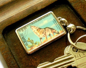 Howling Coyote Keyring - upcycled 1984 postage stamp from Cambodia