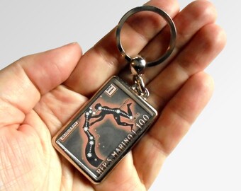 Aquarius Keyring made with upcycled vintage 1970 postage stamp