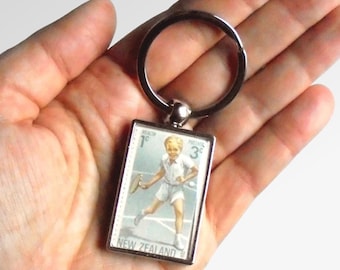Female Tennis Player Keychain, made with real vintage 1971 Japan postal stamp
