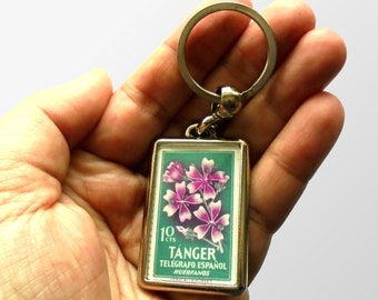 Retro Floral Keyring, violet & green - upcycled 1956 charity stamp