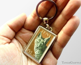 Happy Jackal Keyring - upcycled 1957 postage stamp from Ifni