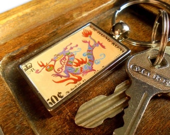 Chinese Year of the Dragon Keyring made with postage stamp from Hong Kong, 1988