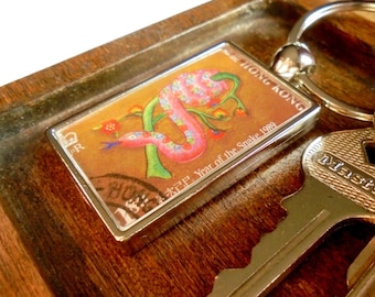Chinese Year of the Snake Keyring made with postage stamp from Hong Kong, 1989