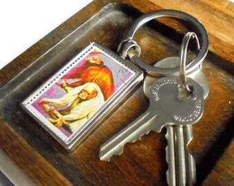 Bald Uakari Monkey Keyring, upcycled 1975 postage stamp from Equatorial Guinea