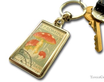 Red & White Mushroom Keychain - upcycled 1958 Romania postage stamp