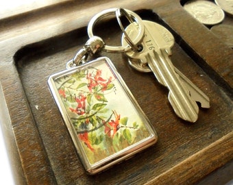 Ruttya Fruticosa Keyring - upcycled 1983 used postage stamp from Kenya