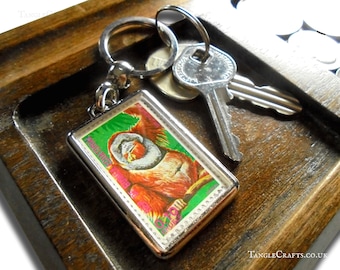 Orangutan Keyring, upcycled 1975 postage stamp from Equatorial Guinea