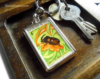 Rhinoceros Beetle Keyring - upcycled vintage 1972 Chad postage stamp