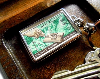 Telegraph Keyring - upcycled 1962 postage stamp from New Zealand