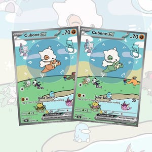 Op de afbeelding: Twee Cubone EX Pok&eacute;mon-verzamelkaarten. Elke kaart bevat een Cubone-karakterillustratie met de tekst "Beat" en "Bone Smash". De kaarten hebben een blauwe, groene en witte achtergrond met andere Pok&eacute;mon-personages.