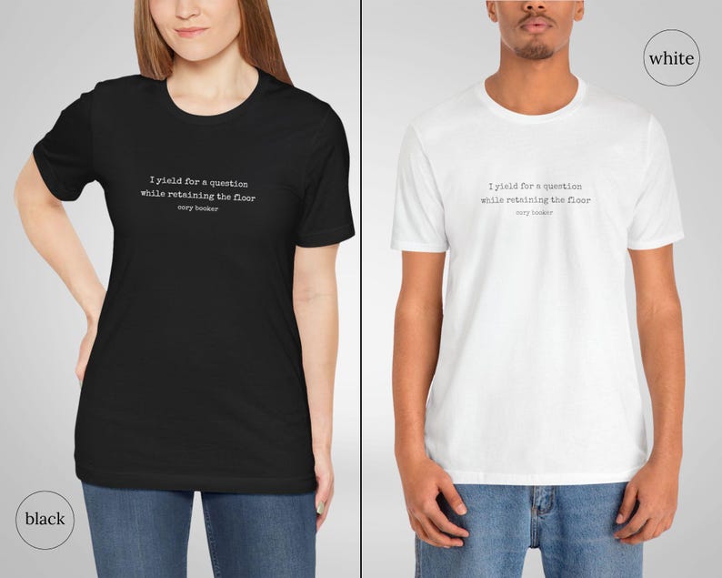 May include: Two t-shirts, one black and one white, with the text 'I yield for a question while retaining the floor cory booker' printed on the front.