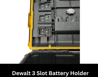 May include: Open black and yellow DeWalt Tough 2.0 box with a 3-slot battery holder installed. The holder is black and designed to securely hold batteries. The box has a yellow trim and a black interior.