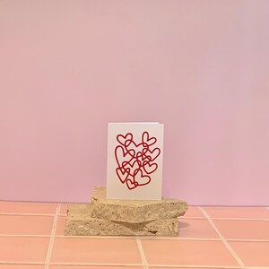 Card. Red Hearts Attached Together. Blank