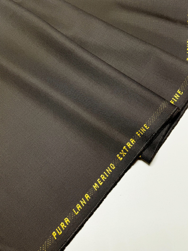 Discover high-quality merino wool in a beautiful gray and brown color. This Fabric is ideal for suits, and jackets, Italian Merino wool is a luxurious fabric, made with wool fibers, extremely soft and comfortable to wear. This fabric gives the things made from this fabric a luxurious look and superb calm.