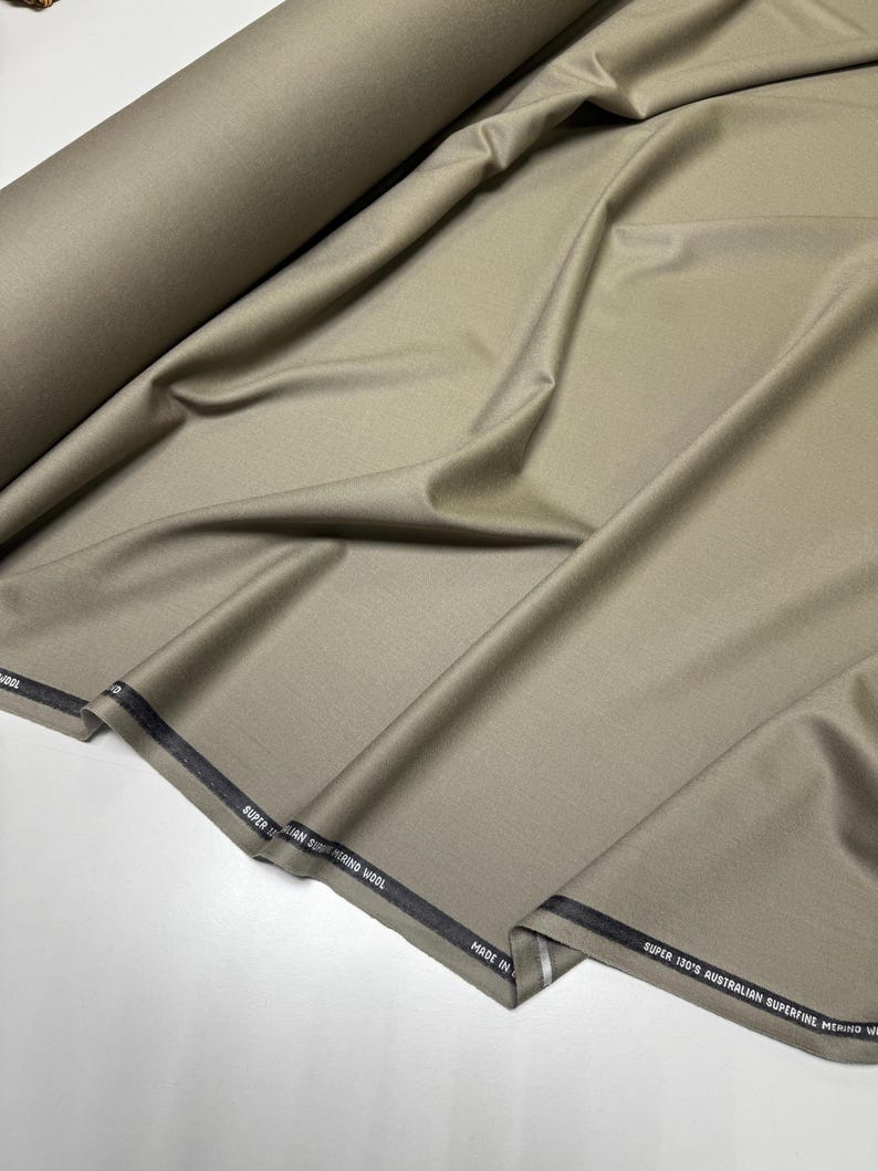 Discover a high-quality Merino Wool in sage color (olive) with a touch of Cashmere thread. This Fabric is ideal for suits, trousers. Merino Wool is a luxurious fabric, made with cashmere fibers, extremely soft and comfortable to wear. This fabric lends a sophisticated look and style to the items made from it.