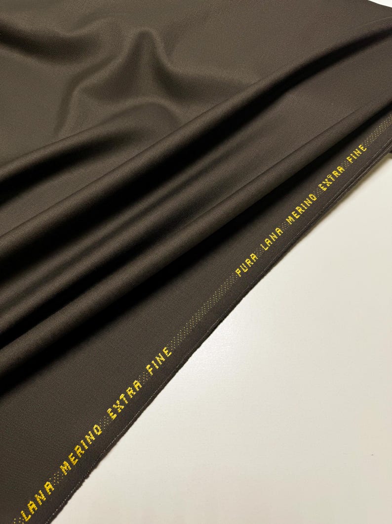 Discover high-quality merino wool in a beautiful gray and brown color. This Fabric is ideal for suits, and jackets, Italian Merino wool is a luxurious fabric, made with wool fibers, extremely soft and comfortable to wear. This fabric gives the things made from this fabric a luxurious look and superb calm.