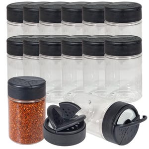 May include: A set of clear plastic spice jars with black lids. One jar is filled with red chilli flakes. The image shows the jars with the lids on, and one jar with the lid and shaker insert removed.