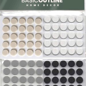 May include: A pack of 120 self-adhesive felt pads in beige, white, grey, and black. The pads are arranged in four rows of 30.  BASICOUTLINE HOME DECOR is printed on the packaging.
