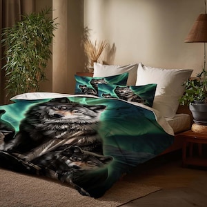 May include: A bed set with a wolf theme. The duvet cover and pillowcases feature a detailed illustration of wolves set against a backdrop of green and blue aurora borealis. The wolves are depicted in shades of grey and black.