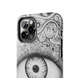 May include: Black and white phone case with a detailed drawing of an eye. The eye is surrounded by swirling patterns and the phone case has a camera lens cutout.