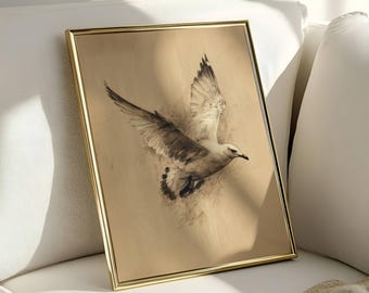 May include: A framed print featuring a detailed charcoal drawing of a seagull in flight. The artwork is set against a tan background and framed in a gold-colored metal frame. The bird's wings are spread, capturing a moment of movement.