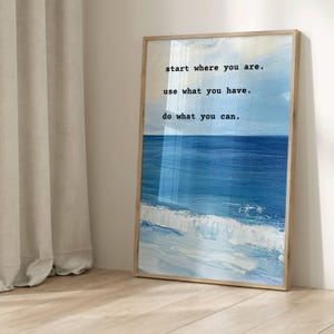 May include: A framed print featuring a blue and white seascape with the text "start where you are. use what you have. do what you can."
