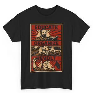 May include: Black t-shirt with a red and beige graphic. The design features the words "EDUCATE, ORGANIZE, REVOLT" and illustrations of a man reading, a person with a megaphone, and a person with a raised fist.