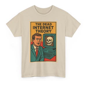 May include: Beige t-shirt with a retro graphic. The graphic shows a man in a suit looking surprised at a computer screen with a skull. The text "THE DEAD INTERNET THEORY" is above the image in a yellow and orange rectangle.