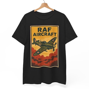 May include: Black t-shirt featuring a vintage-style illustration of an RAF aircraft in flight. The design includes the text "RAF AIRCRAFT" in a yellow rectangle, with a green and brown airplane over red clouds.