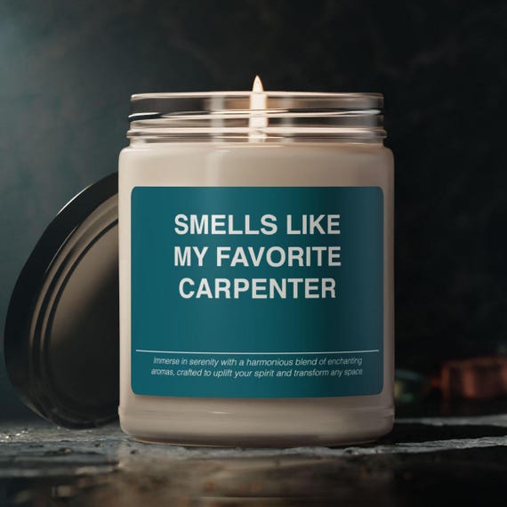 A soy candle scented to smell like a carpenter's workshop — sawdust, wood shavings, and all — making it a genuinely funny and sensory-specific gift for the woodworker who has everything.