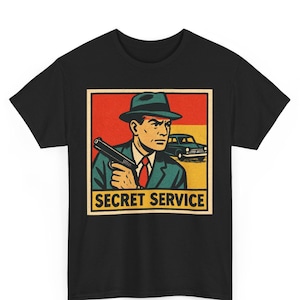 シークレットサービス レトロコミックTシャツ ユニセックス | ヴィンテージスパイポップアートグラフィックTシャツ | 大胆なミステリーエージェントシャツ | 彼または彼女へのギフト ストリートウェア
