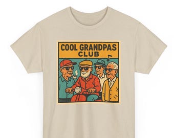 May include: A beige t-shirt with a graphic of four older men wearing sunglasses and riding a scooter. The graphic is in a retro style with a colorful background and the text "COOL GRANDPAS CLUB".