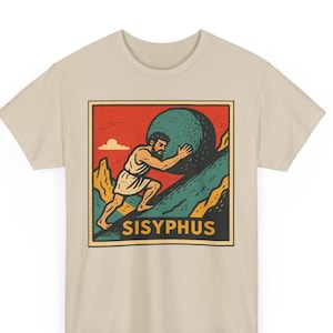 May include: Beige t-shirt featuring a graphic of Sisyphus pushing a large boulder uphill. The illustration is in a retro style with a red sky, green mountain, and the word "SISYPHUS" in a yellow font.
