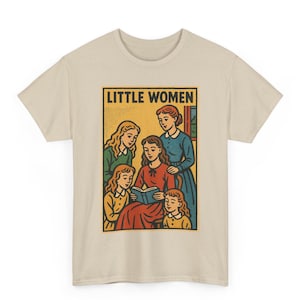 May include: Beige t-shirt featuring a graphic from the novel "Little Women." The graphic shows five women, with one reading a book. The text "Little Women" is in a yellow rectangle at the top. The illustration is in a vintage style.
